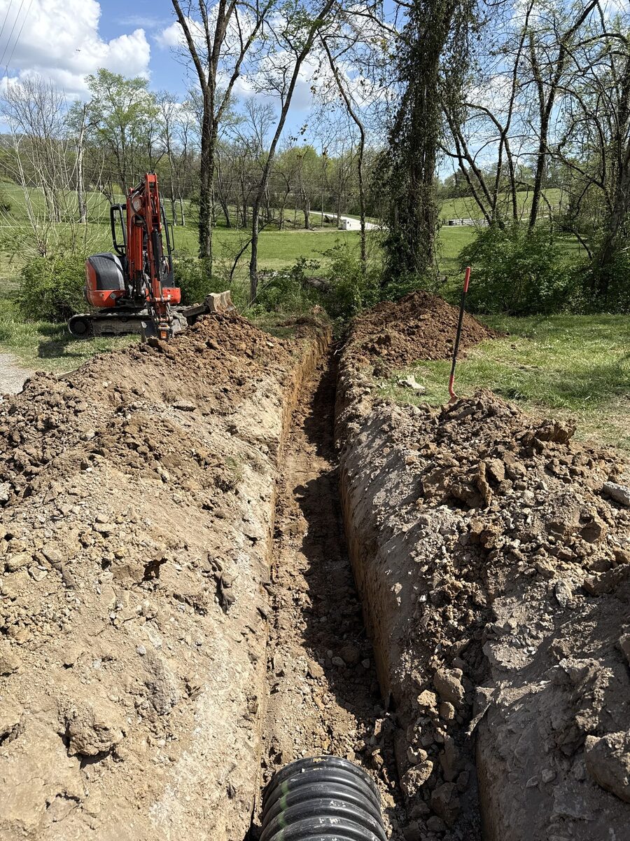 Deep drainage trench excavation with mini excavator
