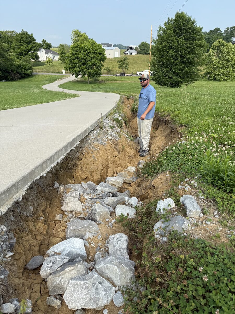 Driveway erosion washout before repair — Hendersonville TN