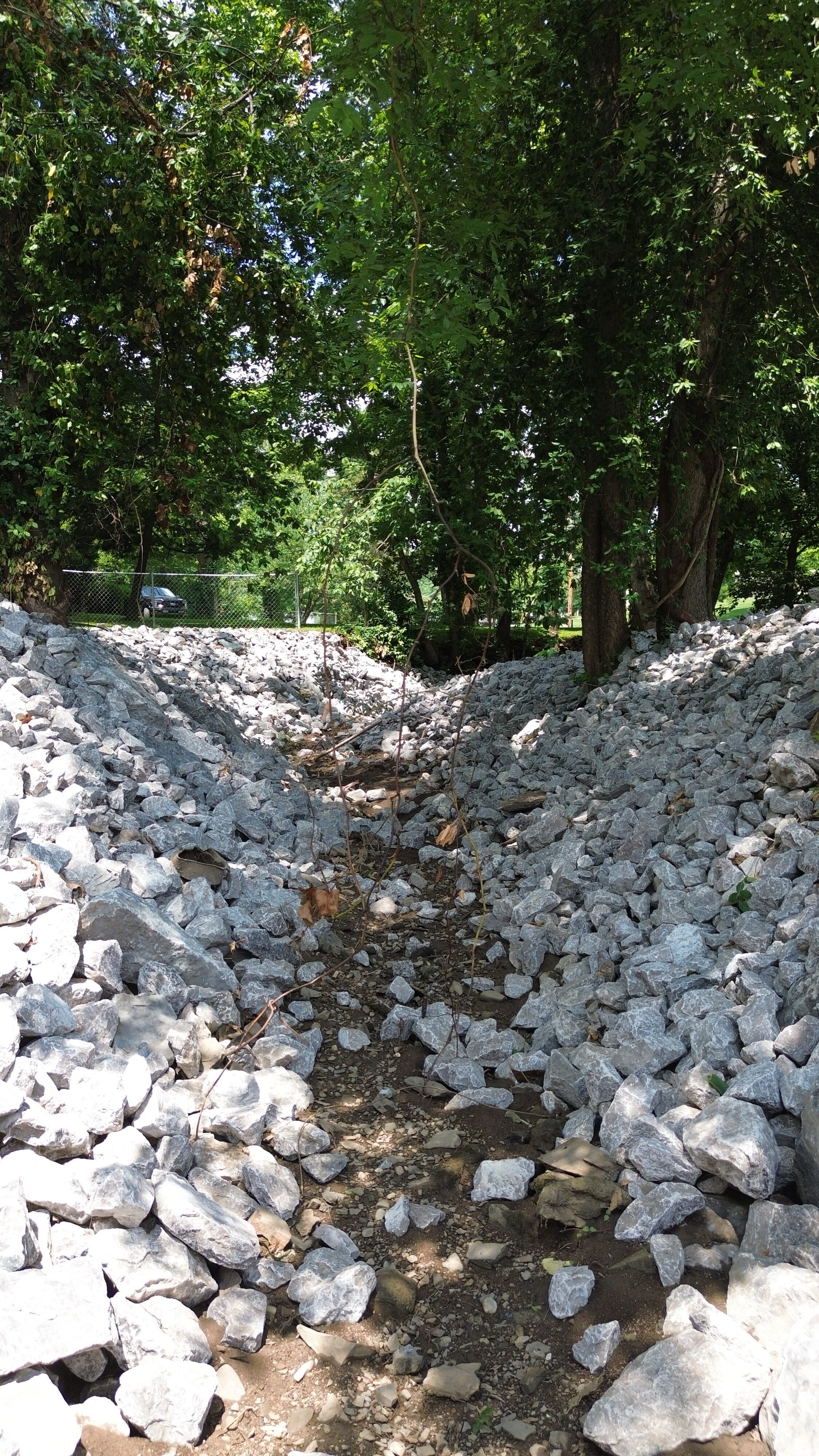 Close aerial view of riprap erosion control installation