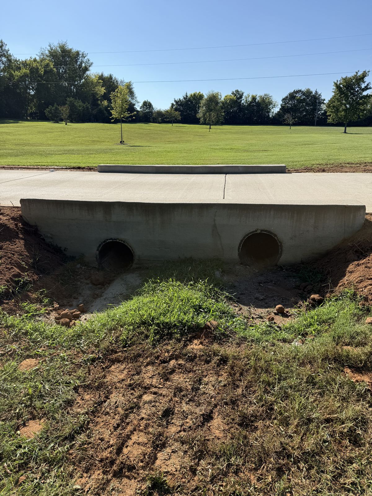 Driveway culvert outlet opened up for regrading after concrete removal &mdash; Greenbrier TN