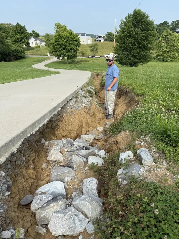 Driveway erosion washout before repair — Hendersonville TN