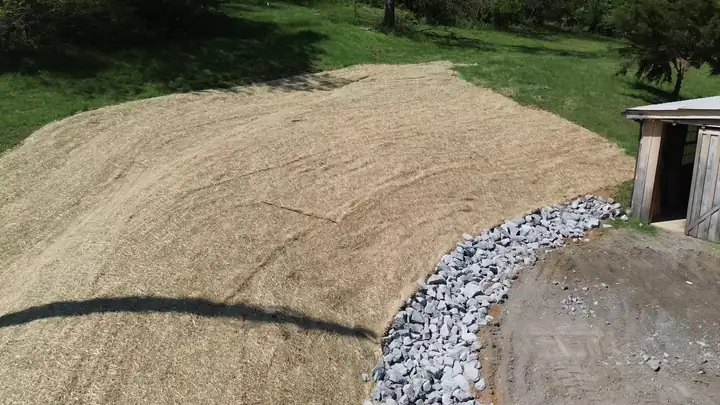 Aerial — straw matting and riprap erosion control after grading
