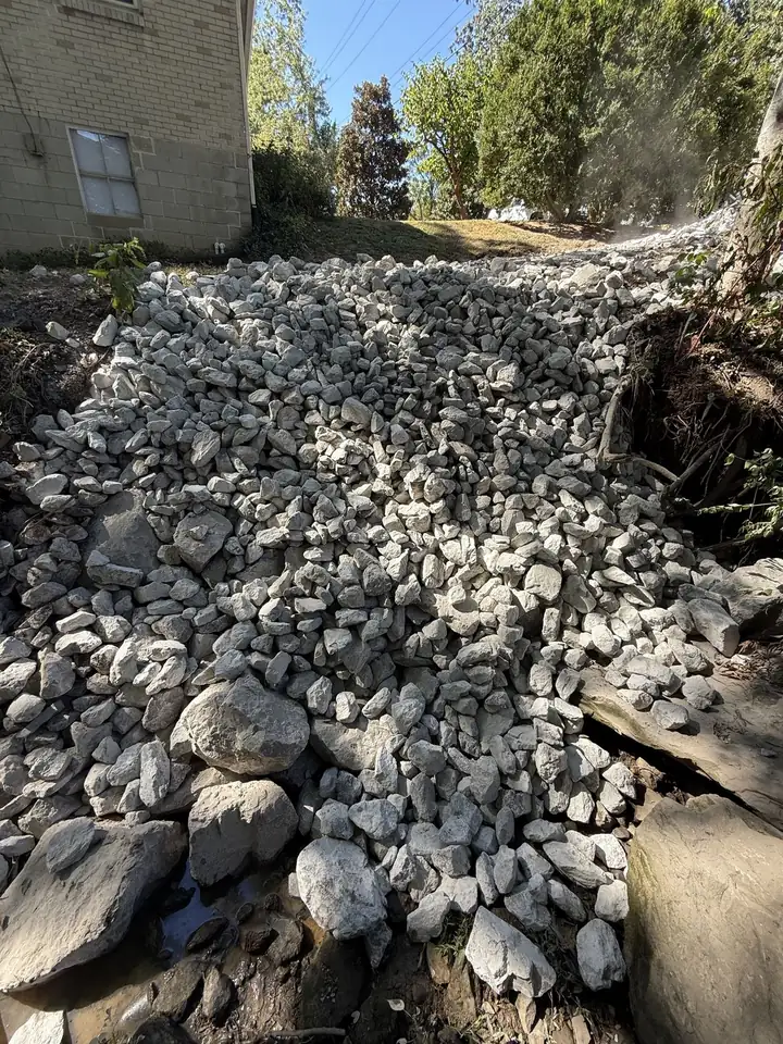 Creek bank armored with Class B riprap dressed in Class A beside a driveway — Nashville TN